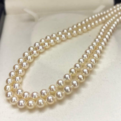 LongAkoya 96cm 2 strand necklace featuring 6.5mm round white Akoya pearls with silver marking