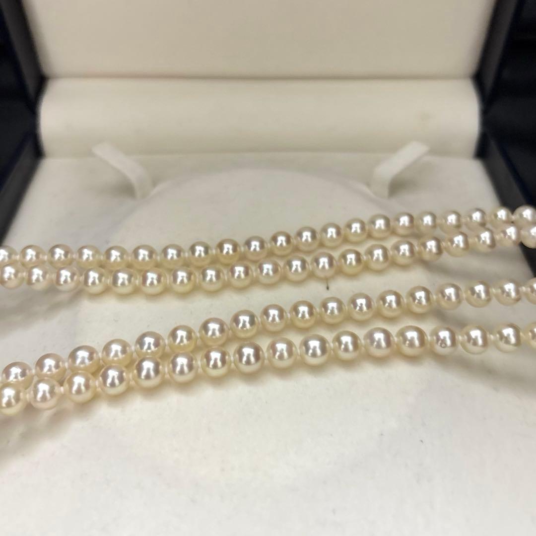 LongAkoya 96cm 2 strand necklace featuring 6.5mm round white Akoya pearls with silver marking