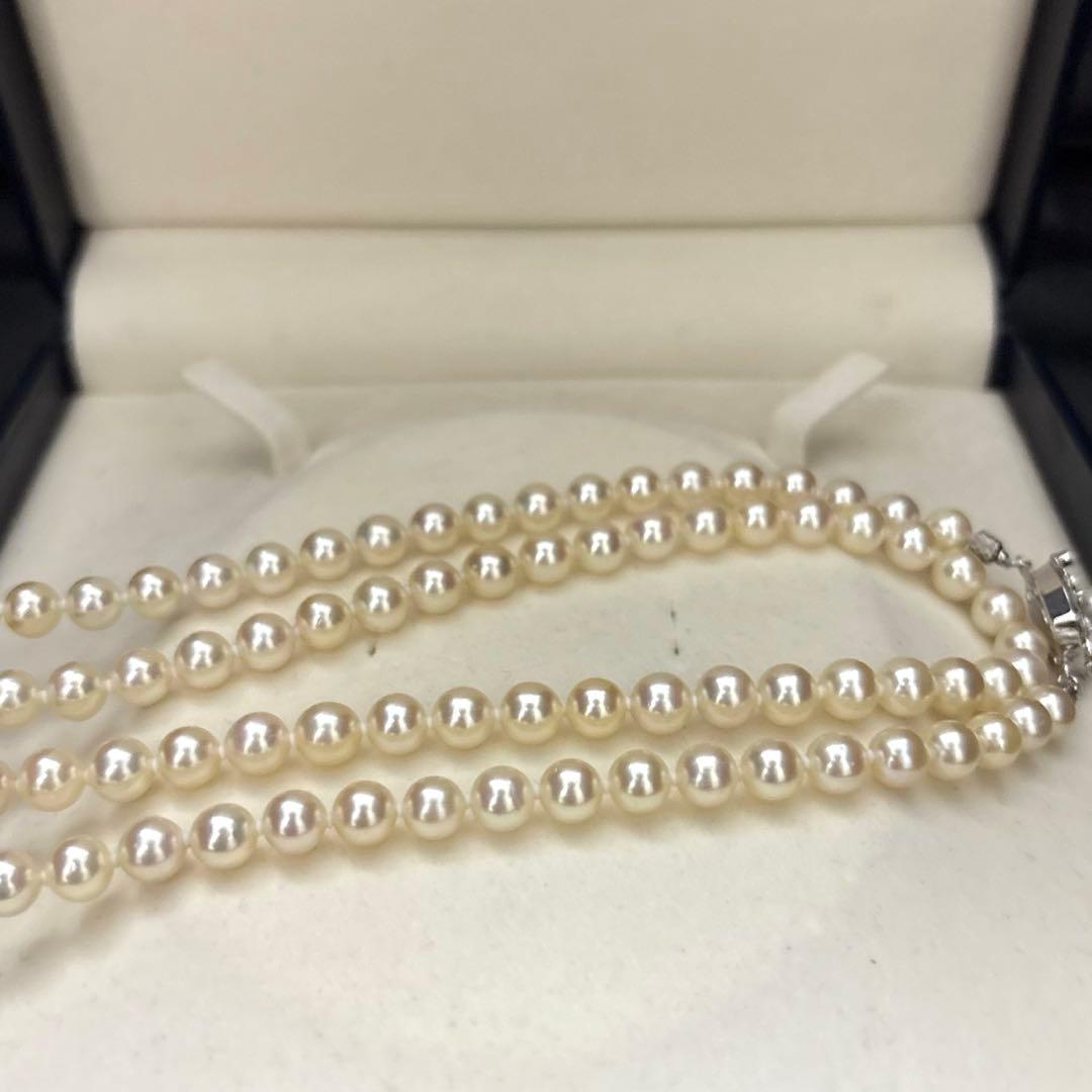 LongAkoya 96cm 2 strand necklace featuring 6.5mm round white Akoya pearls with silver marking