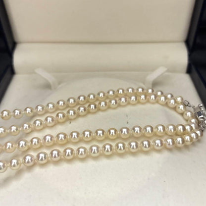 LongAkoya 96cm 2 strand necklace featuring 6.5mm round white Akoya pearls with silver marking