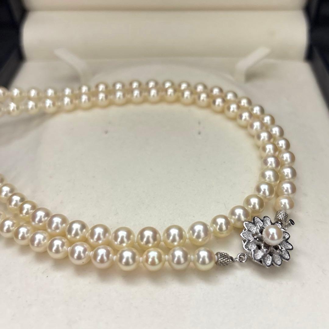LongAkoya 96cm 2 strand necklace featuring 6.5mm round white Akoya pearls with silver marking