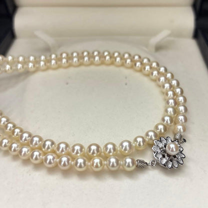 LongAkoya 96cm 2 strand necklace featuring 6.5mm round white Akoya pearls with silver marking