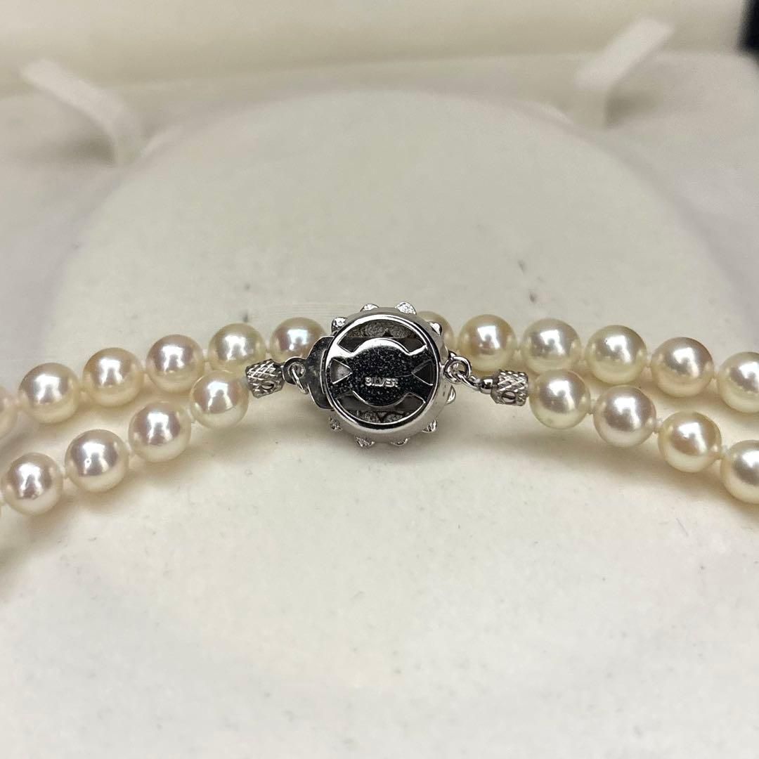 LongAkoya 96cm 2 strand necklace featuring 6.5mm round white Akoya pearls with silver marking