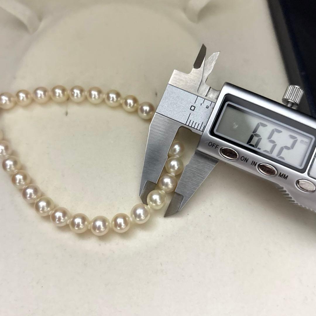LongAkoya 96cm 2 strand necklace featuring 6.5mm round white Akoya pearls with silver marking