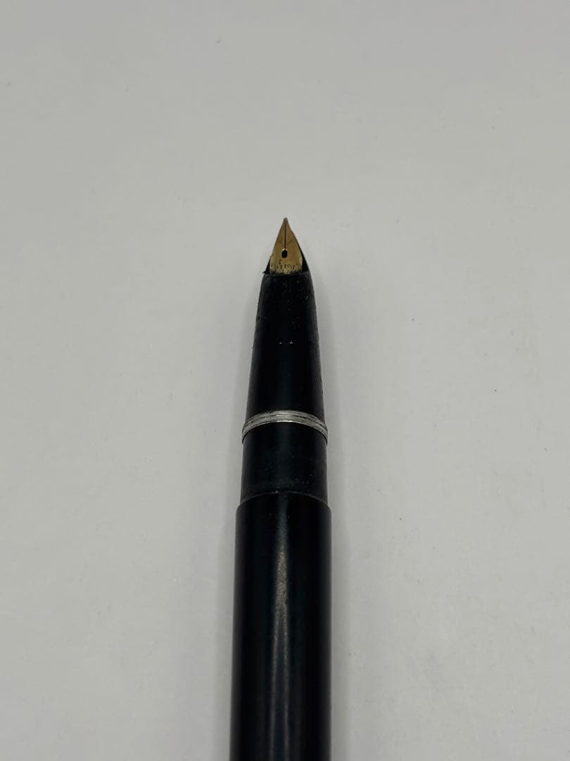 Pilot fountain pen with 14K inset nib, black barrel, and silver cap