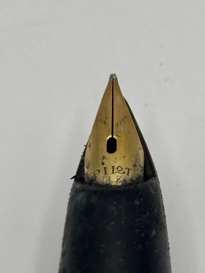 Pilot fountain pen with 14K inset nib, black barrel, and silver cap