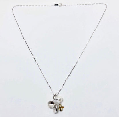 Mikimoto silver necklace with a 6.9mm pearl and four-leaf clover pendant on a 44.5cm chain