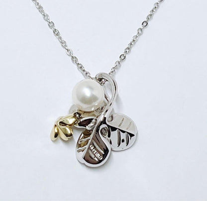 Mikimoto silver necklace with a 6.9mm pearl and four-leaf clover pendant on a 44.5cm chain