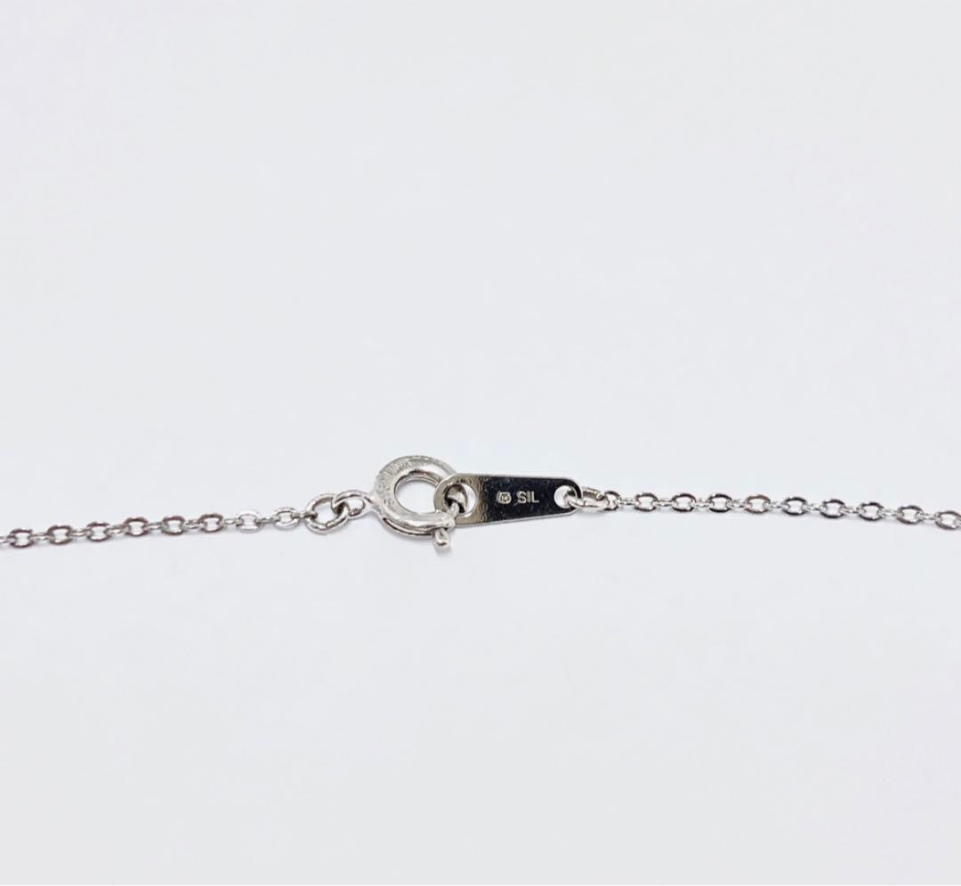 Mikimoto silver necklace with a 6.9mm pearl and four-leaf clover pendant on a 44.5cm chain