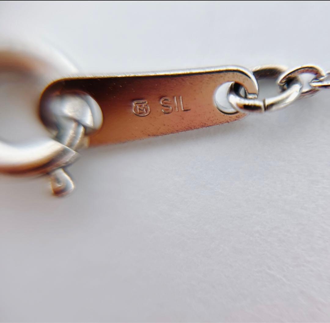 Mikimoto silver necklace with a 6.9mm pearl and four-leaf clover pendant on a 44.5cm chain