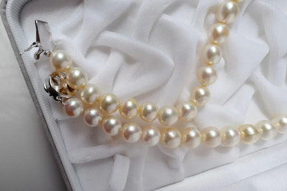 Akoya pearl genuine pearl necklace with deformed large beads 10.8-8.5mm in ivory pink and green hues, 43.3cm silver fittings