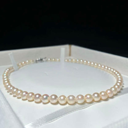 Akoya pearl necklace with 6.5-7.0mm round white pearls on a 42.5cm silver chain stamped SILVER