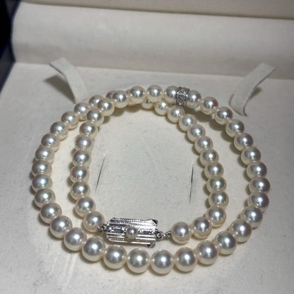 Mikimoto Akoya pearl necklace with 7.0-7.5mm pearls and silver clasp on a white background