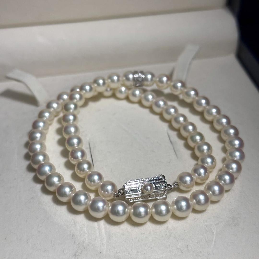 Mikimoto Akoya pearl necklace with 7.0-7.5mm pearls and silver clasp on a white background