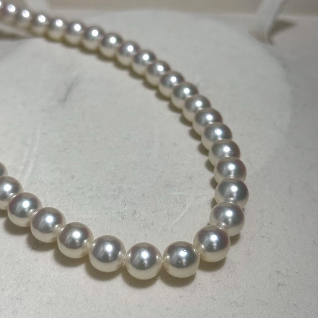 Mikimoto Akoya pearl necklace with 7.0-7.5mm pearls and silver clasp on a white background