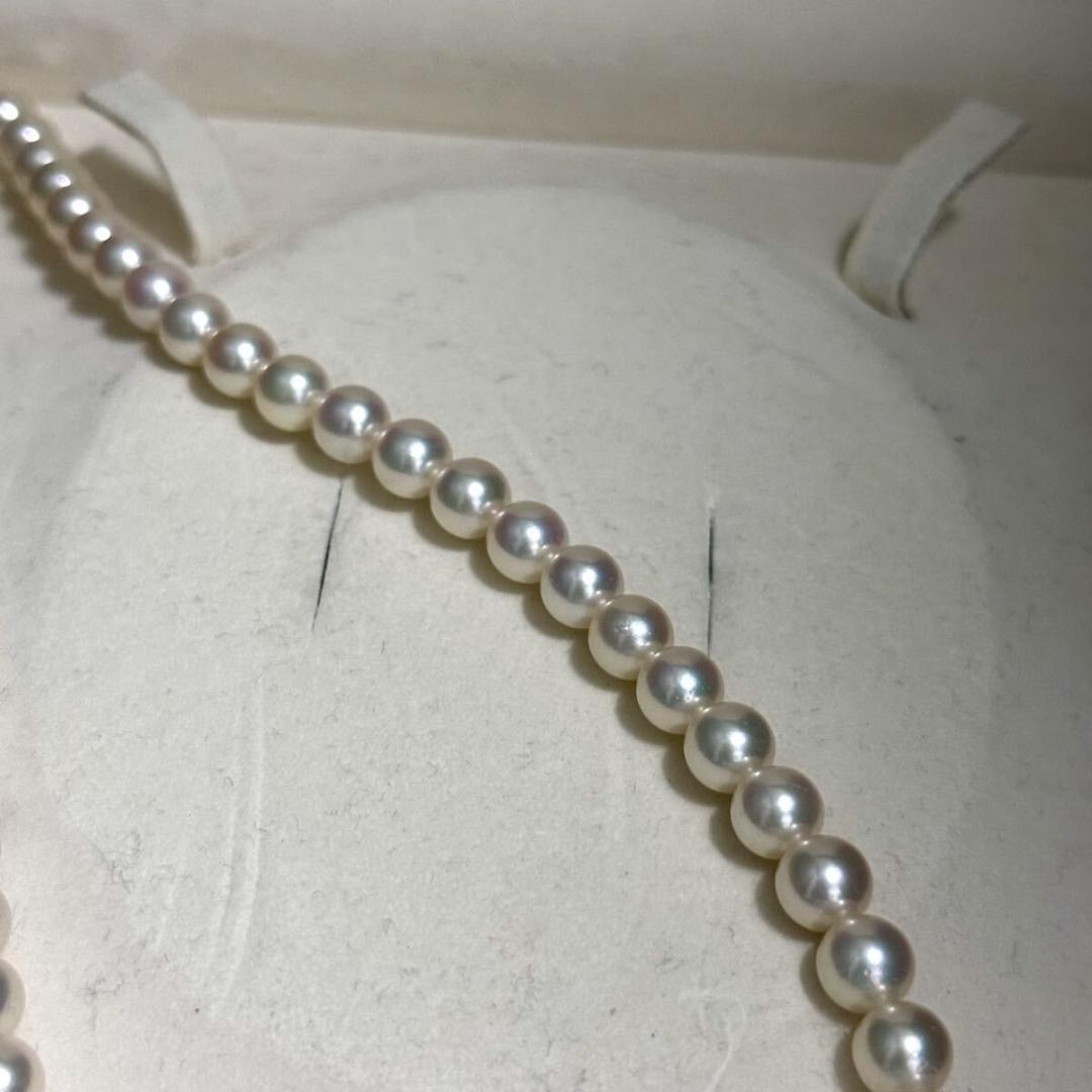 Mikimoto Akoya pearl necklace with 7.0-7.5mm pearls and silver clasp on a white background