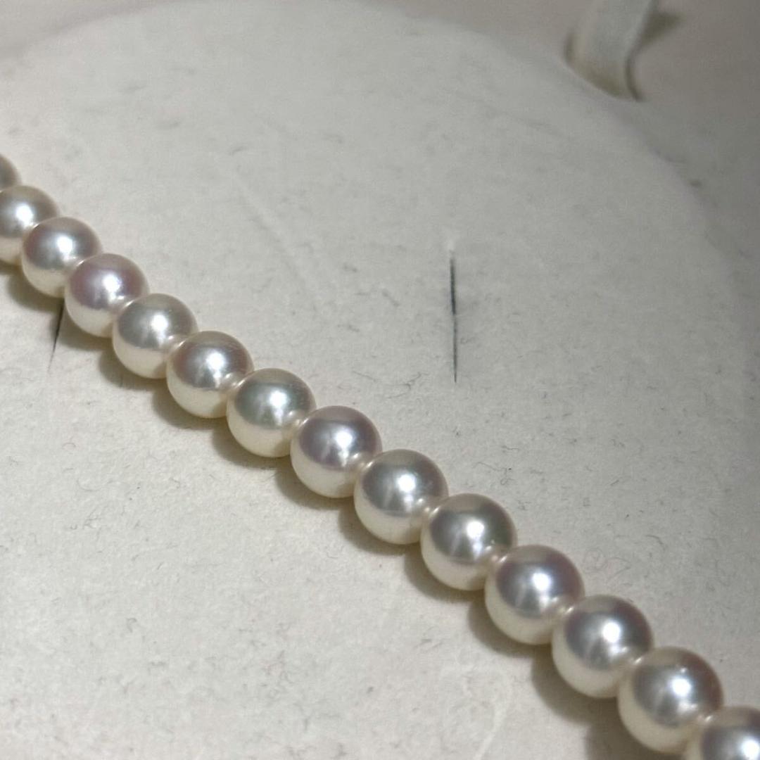 Mikimoto Akoya pearl necklace with 7.0-7.5mm pearls and silver clasp on a white background