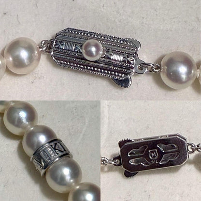 Mikimoto Akoya pearl necklace with 7.0-7.5mm pearls and silver clasp on a white background