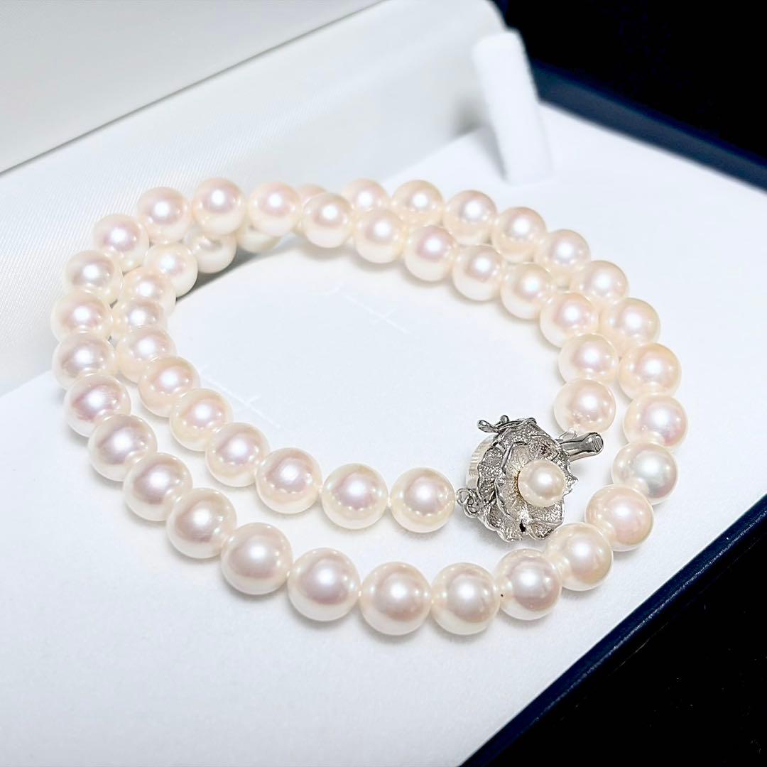 Honka Pearl Akoya necklace with 8.0-8.5mm white pearls and silver clasp on a white background