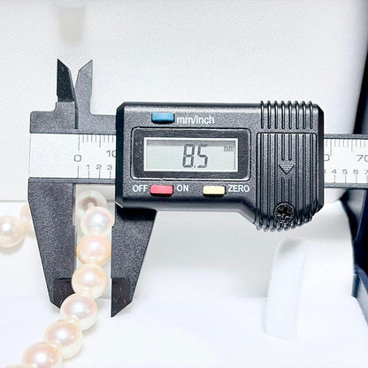 Honka Pearl Akoya necklace with 8.0-8.5mm white pearls and silver clasp on a white background