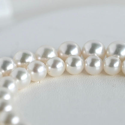 Aurora Hanadama Mikimoto Akoya pearl necklace with round pearls 7.5-5.0 mm and silver clasp on 40 cm string