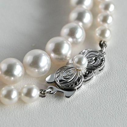 Aurora Hanadama Mikimoto Akoya pearl necklace with round pearls 7.5-5.0 mm and silver clasp on 40 cm string