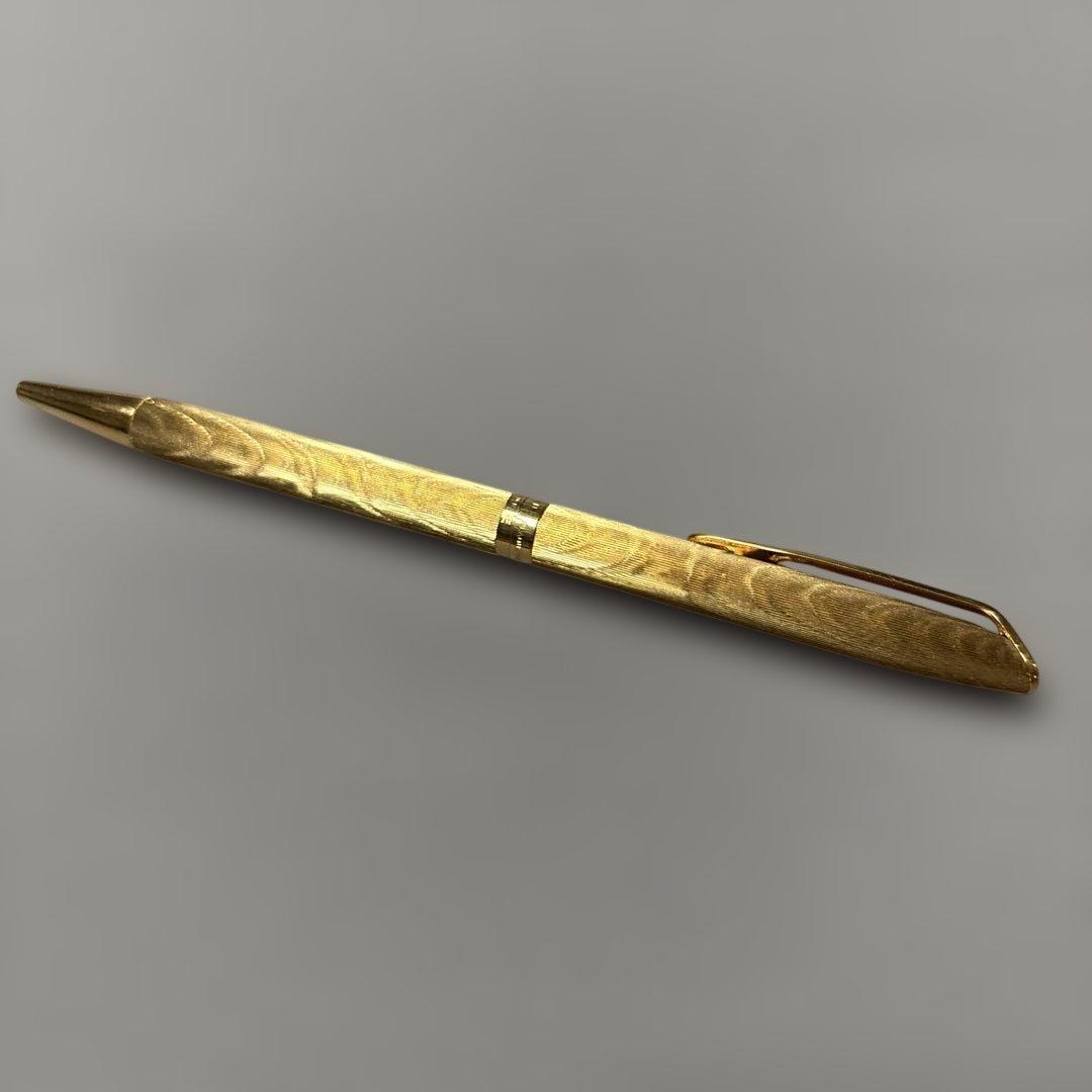 Waterman gold color ballpoint pen with sleek design and smooth finish