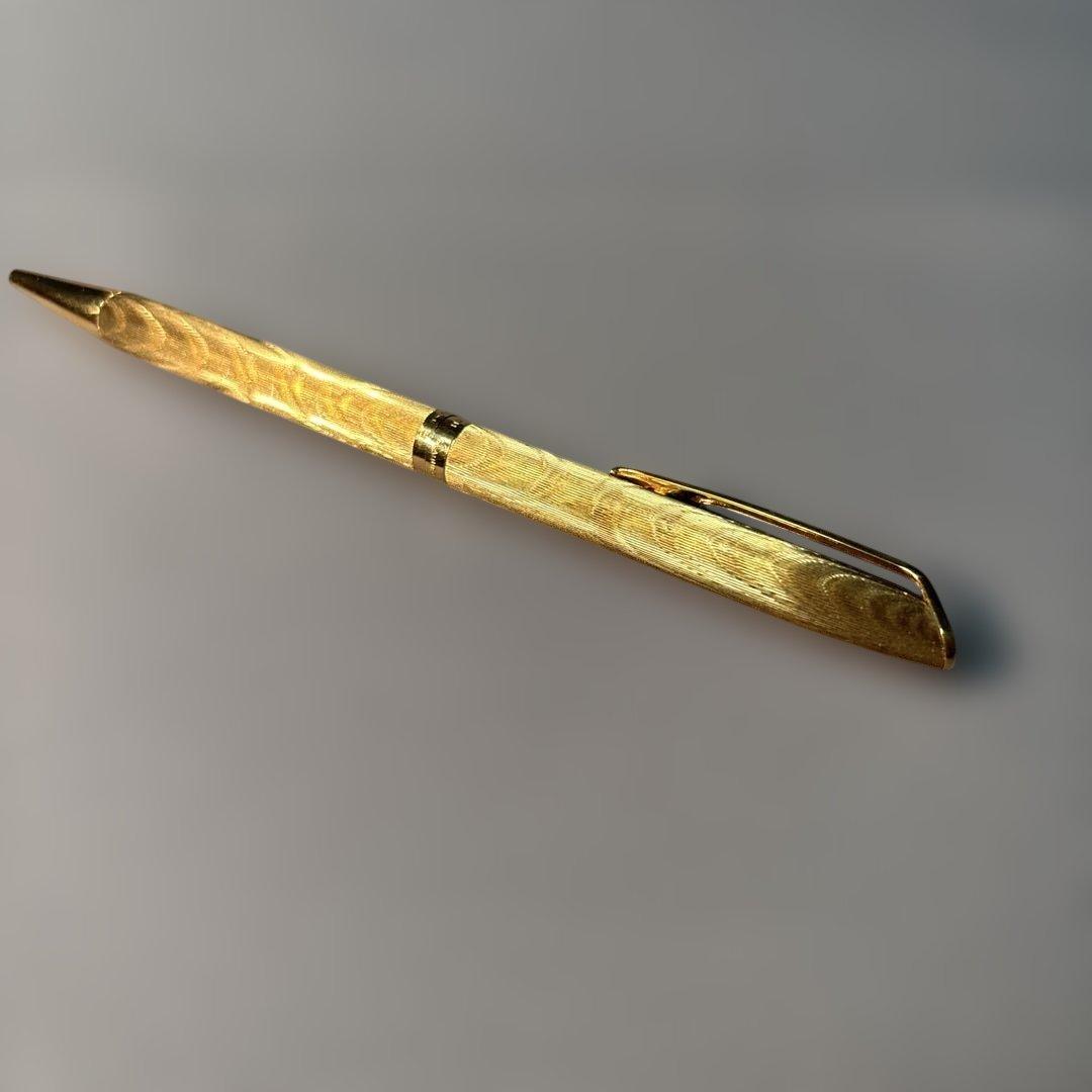 Waterman gold color ballpoint pen with sleek design and smooth finish