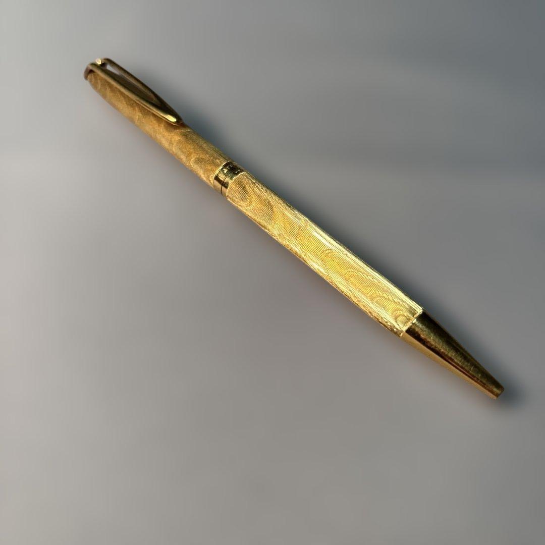 Waterman gold color ballpoint pen with sleek design and smooth finish