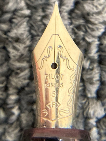 Pilot black fountain pen with 14K-585 fine nib and gold trim