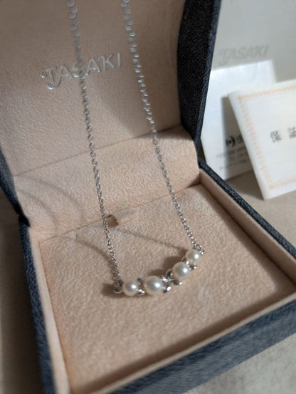 Tasaki Baby Pearl Silver Necklace with white baby pearls, adjustable 200mm length, displayed with certificate and box