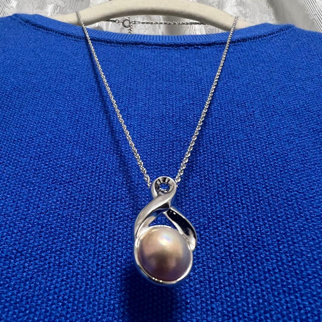 Tasaki Pearl Necklace with curved design and solid Mabe pearl pendant on engraved clasp closure