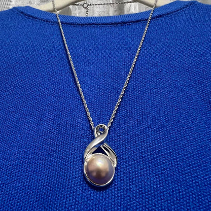 Tasaki Pearl Necklace with curved design and solid Mabe pearl pendant on engraved clasp closure