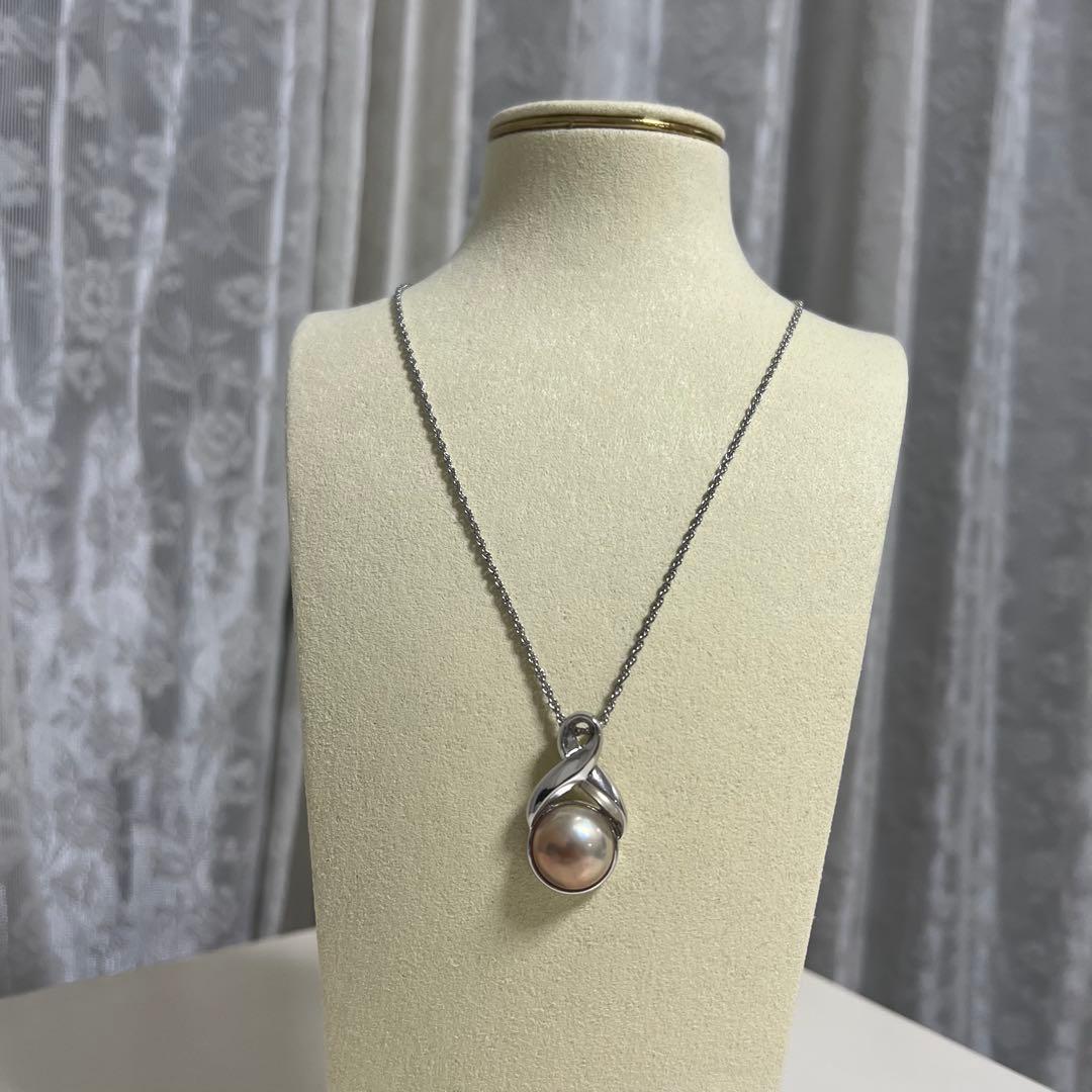 Tasaki Pearl Necklace with curved design and solid Mabe pearl pendant on engraved clasp closure