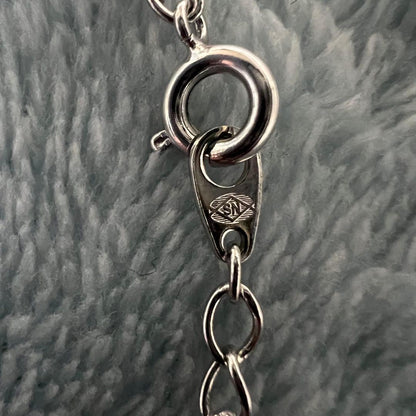 Tasaki Pearl Necklace with curved design and solid Mabe pearl pendant on engraved clasp closure