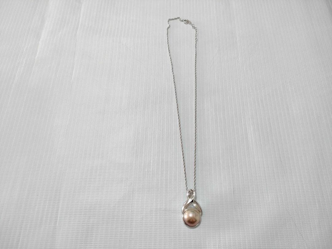 Tasaki Pearl Necklace with curved design and solid Mabe pearl pendant on engraved clasp closure