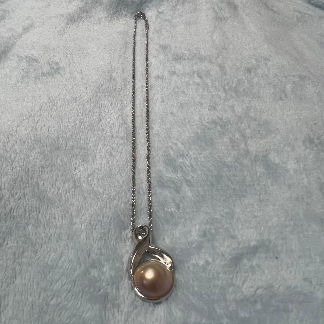 Tasaki Pearl Necklace with curved design and solid Mabe pearl pendant on engraved clasp closure
