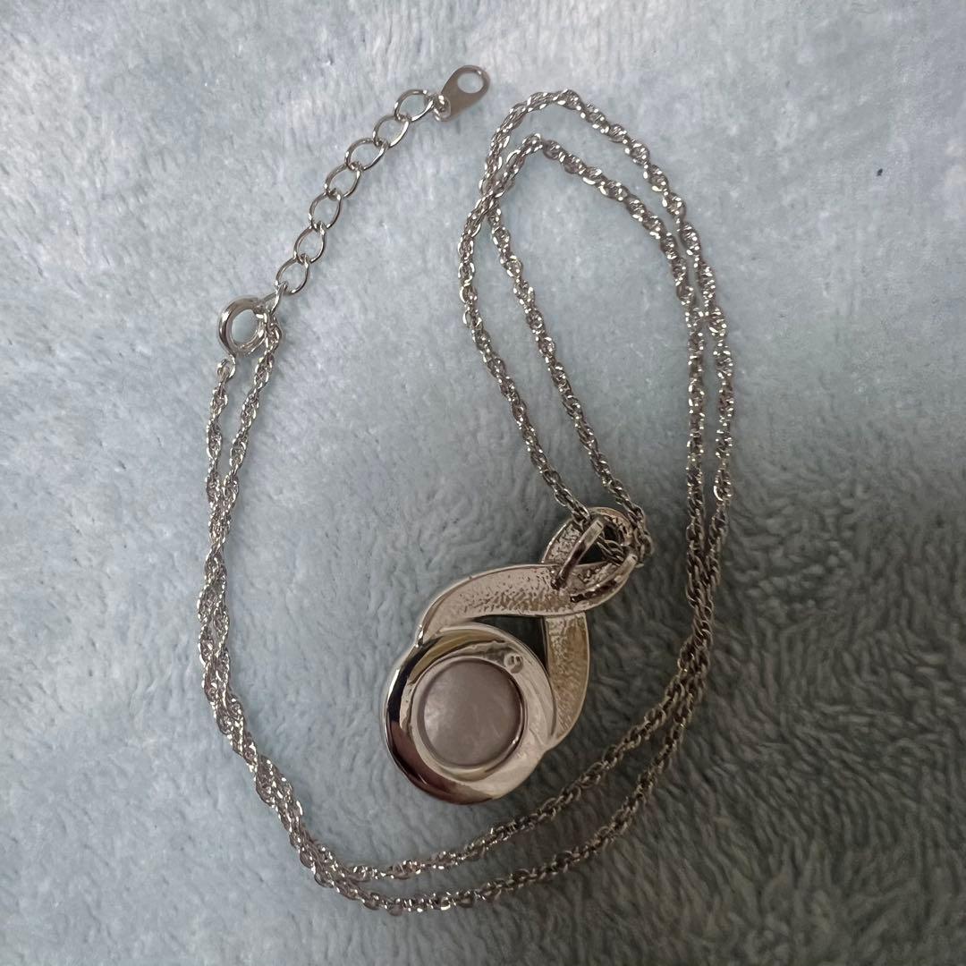 Tasaki Pearl Necklace with curved design and solid Mabe pearl pendant on engraved clasp closure