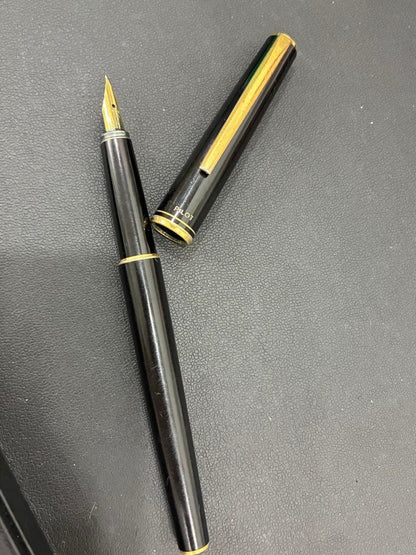 PILOT Fountain Pen in black color with extra fine nib positioned on white background