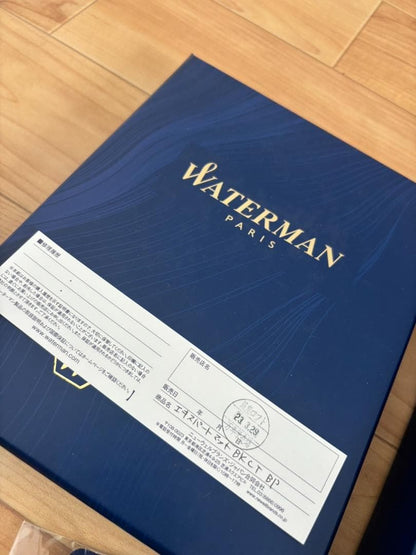 Waterman ballpoint pen with gold accents and included paper bag and accessories from 2023