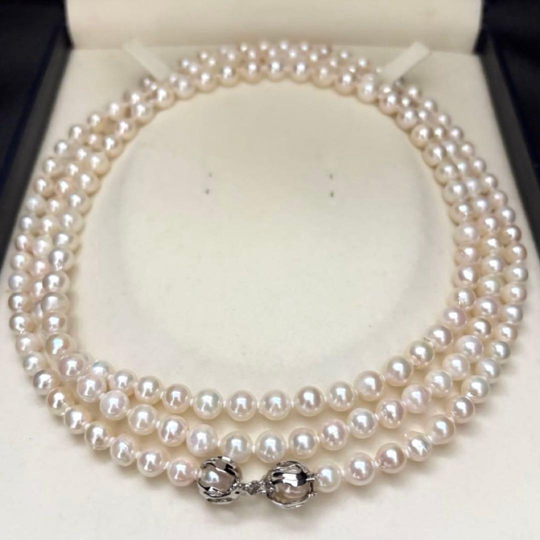 Long 121cm triple strand Akoya pearl necklace with 7.5mm pearls and silver clasp