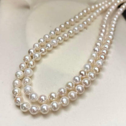 Long 121cm triple strand Akoya pearl necklace with 7.5mm pearls and silver clasp