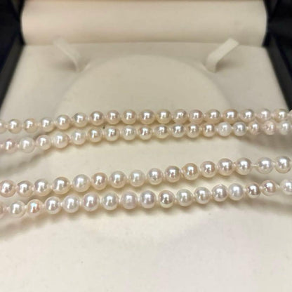 Long 121cm triple strand Akoya pearl necklace with 7.5mm pearls and silver clasp