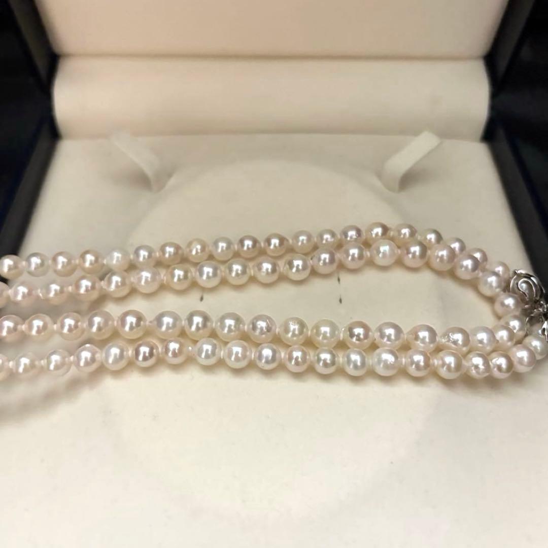 Long 121cm triple strand Akoya pearl necklace with 7.5mm pearls and silver clasp