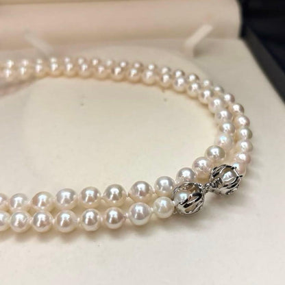 Long 121cm triple strand Akoya pearl necklace with 7.5mm pearls and silver clasp