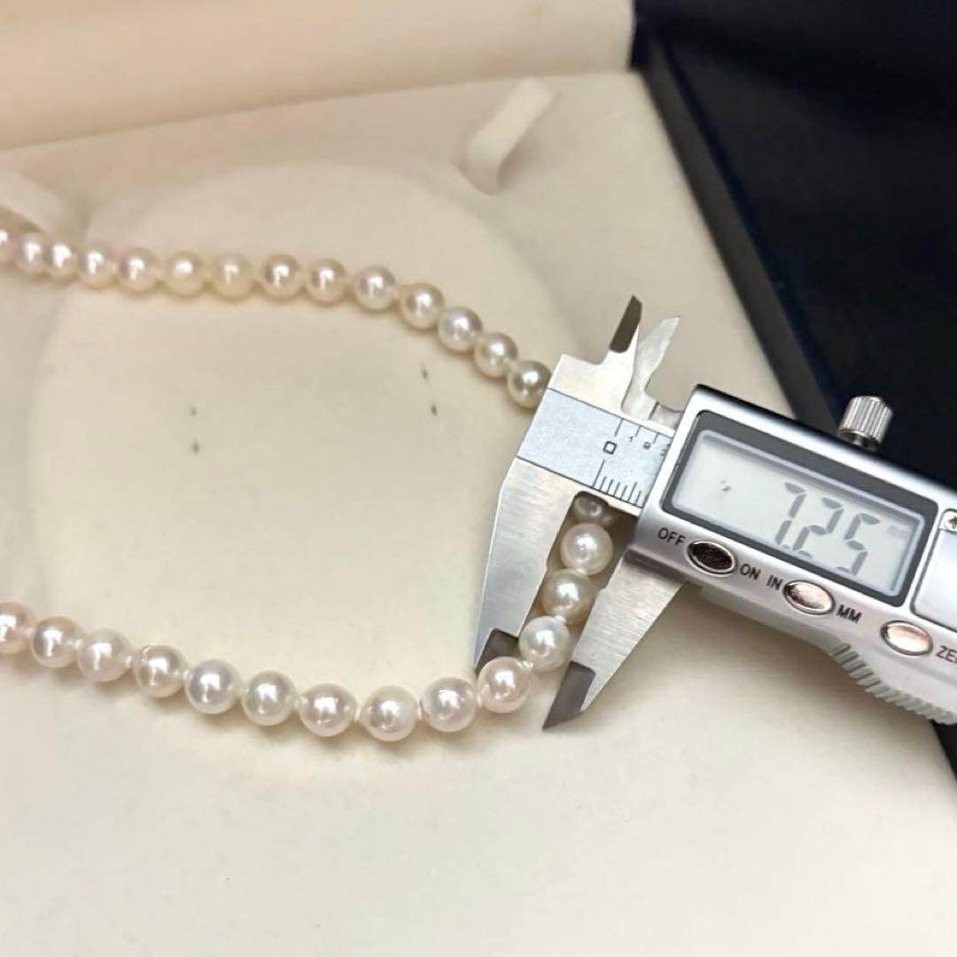 Long 121cm triple strand Akoya pearl necklace with 7.5mm pearls and silver clasp
