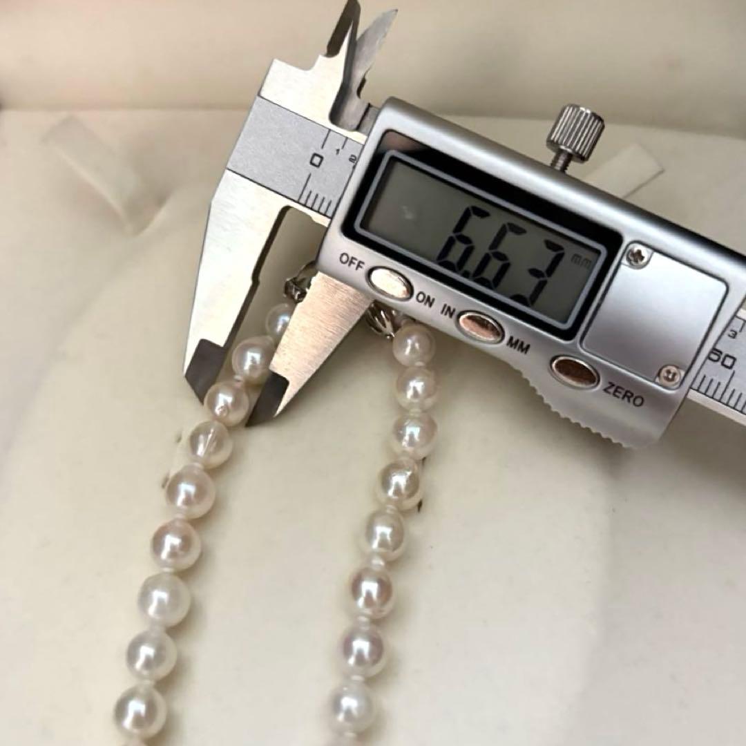Long 121cm triple strand Akoya pearl necklace with 7.5mm pearls and silver clasp