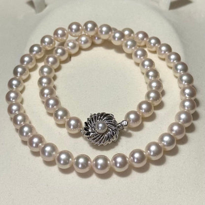 Akoya pearl necklace with 7.5-8.0mm pearls and silver engraved clasp, approximately 43cm long