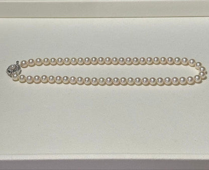 Akoya pearl necklace with 7.5-8.0mm pearls and silver engraved clasp, approximately 43cm long