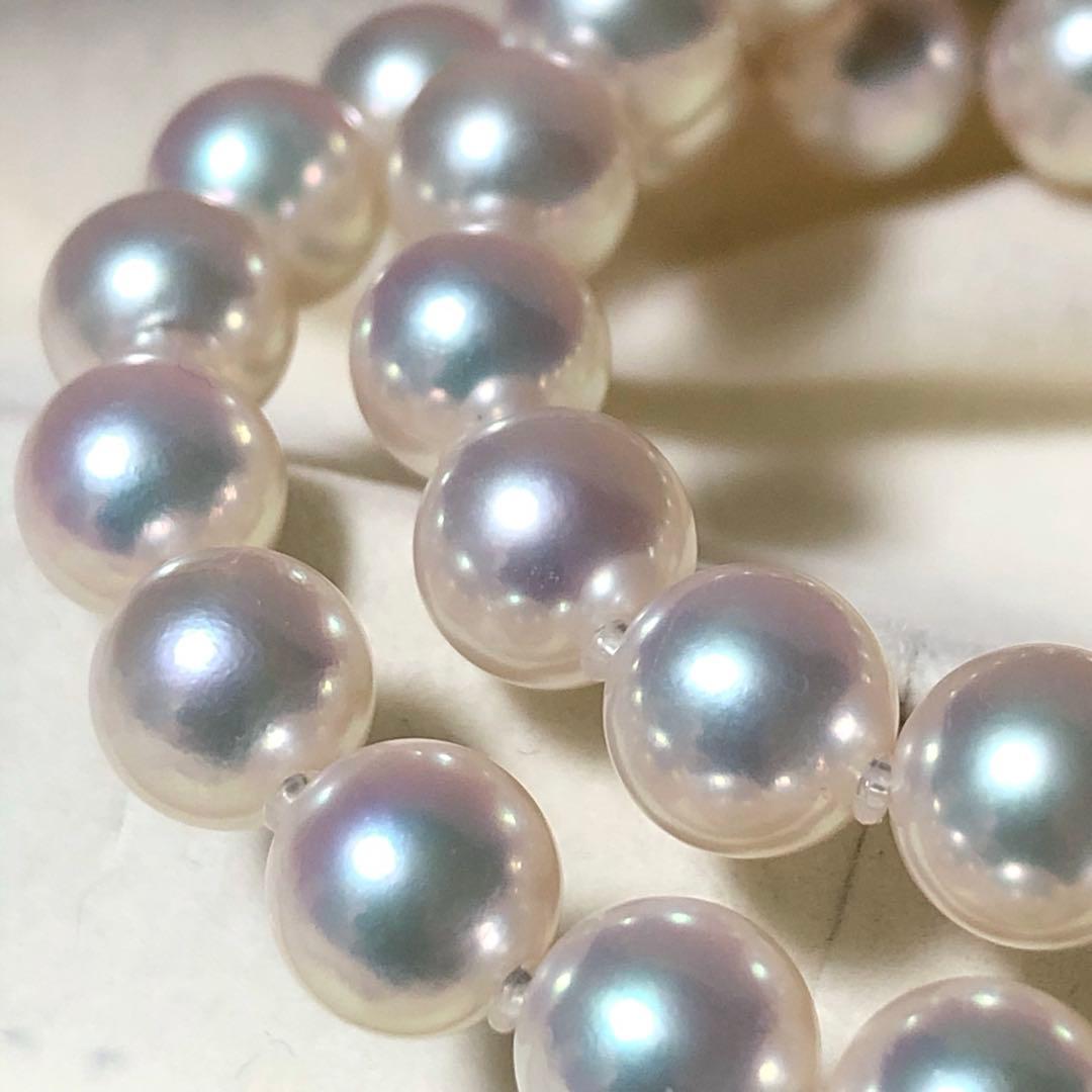 Akoya pearl necklace with 7mm white pearls and silver clasp laid flat showing length and bead size